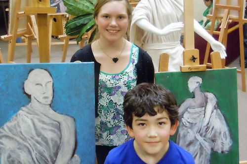 Land O' Lakes Art Club participants Gabriel Hull and Aurora French with their finished paintings at the special Vernissage at LOLPS on April 2.